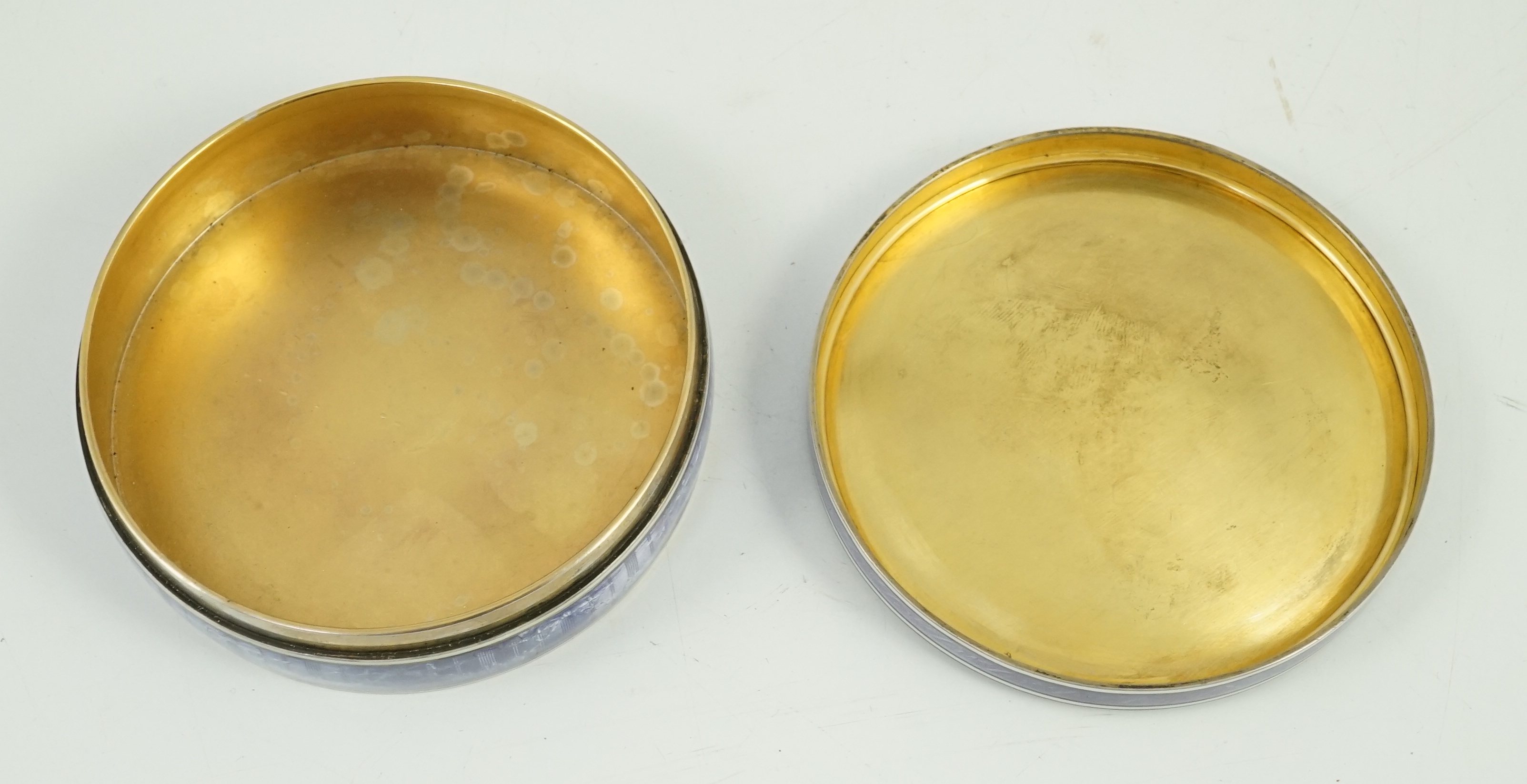 A 19th century French part engine turned silver and guilloche enamelled circular box and cover